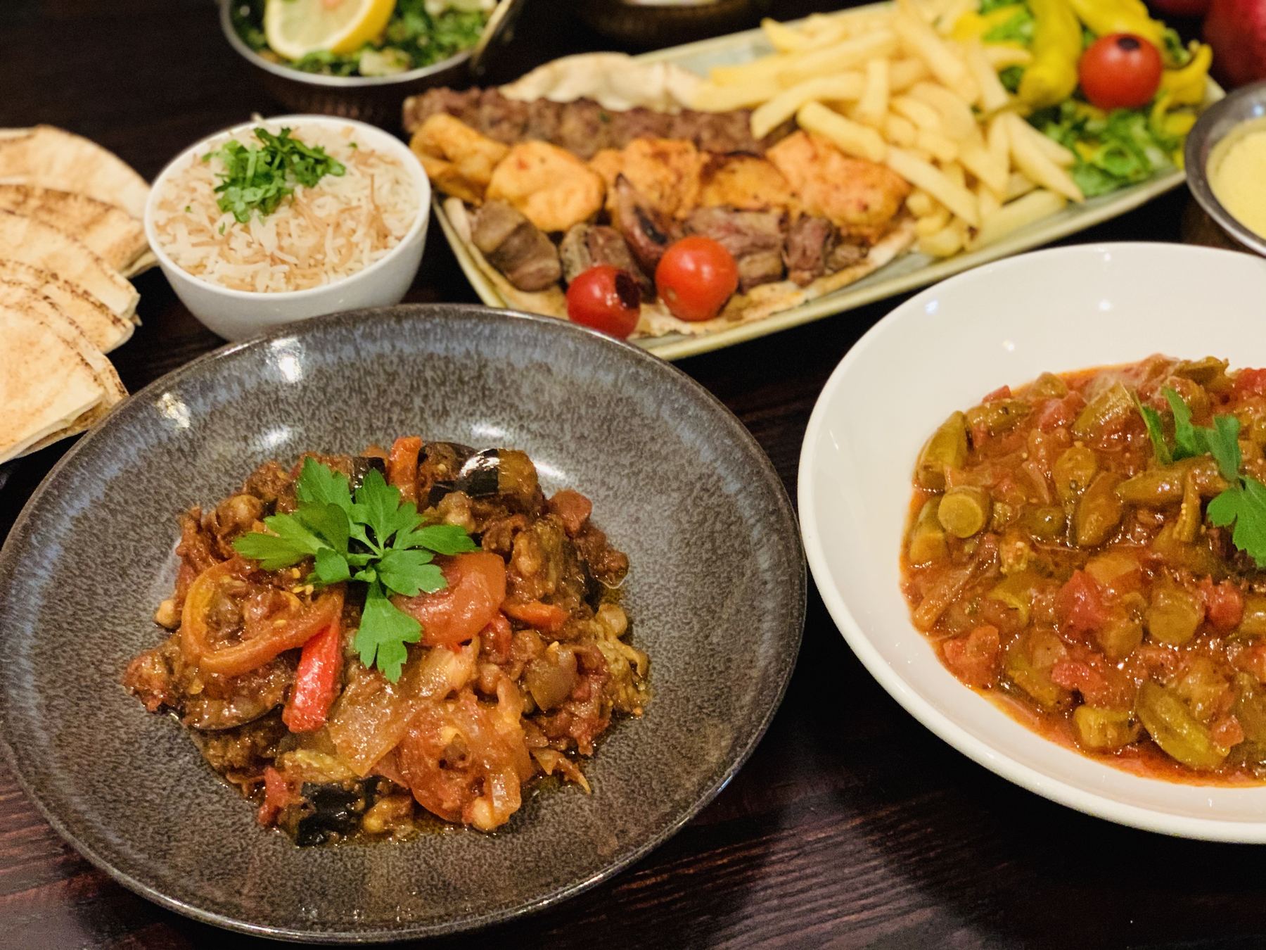 A table of mezze, grills and stews
